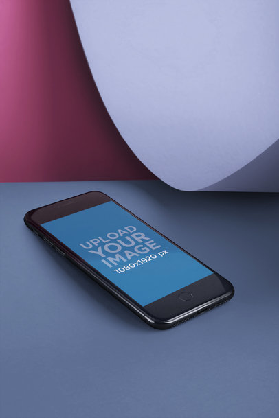 Space Gray iPhone 8 Mockup Lying in a Multicolor Room Near a Shape a20220