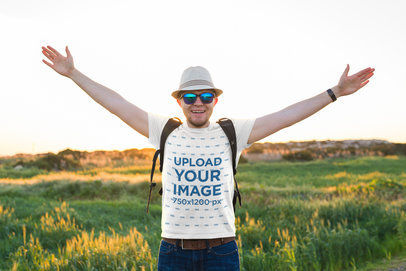 T-Shirt Mockup of a Happy Man Posing With His Arms Wide Open