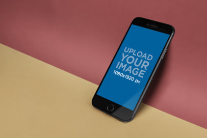 Angled iPhone 8 Mockup Lying on a Surface with Two Colors