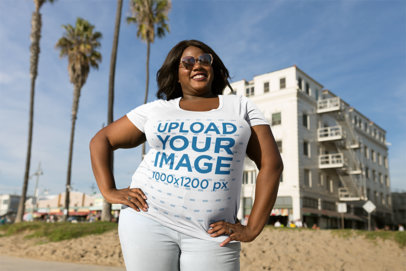 Mockup of a Happy Woman Wearing a Plus Size T-Shirt Near Palm Trees 18220