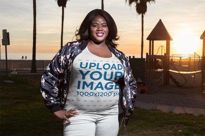 Smiling Woman Wearing a Plus Size Tee Mockup at the Beach