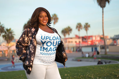 Plus Size T-Shirt Mockup Being Worn by a Woman Facing the Sunset 18303