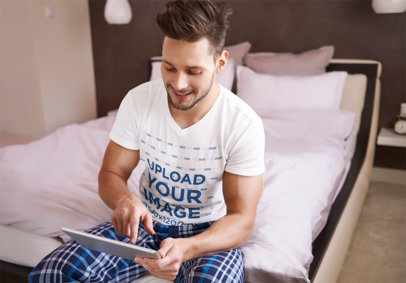 V-Neck T-Shirt Mockup of a Smiling Man Checking His Tablet m14072 r-el2