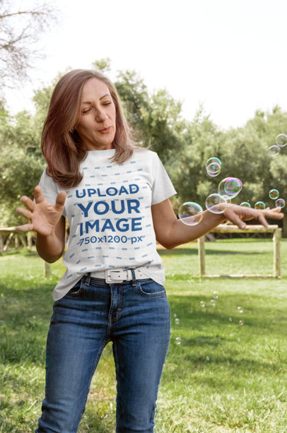 T-Shirt Mockup of a Woman Looking at Some Bubbles