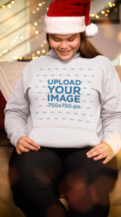 Pullover Hoodie Video Featuring a Happy Woman Wearing Christmas Hat