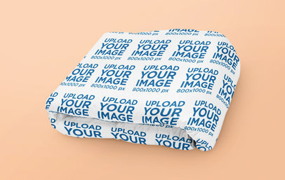 Mockup of a Sublimated Throw Blanket Folded on a Solid Surface