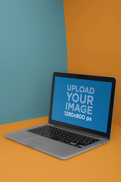 MacBook Mockup Placed in a Room with Two Colors a20325