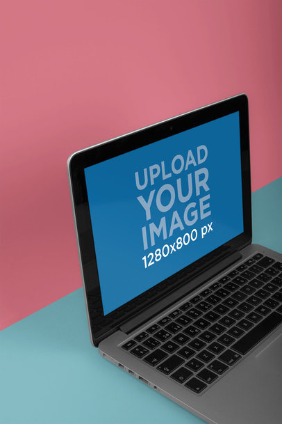 Mockup Featuring a MacBook Resting on a Two Colored Room a20327