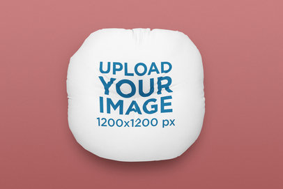 Home Decor Mockup Featuring a Floor Pillow Lying on a Colorful Background