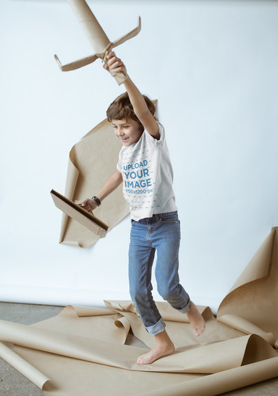 Kid Playing with Cardboard Toys Wearing a T-Shirt Mockup