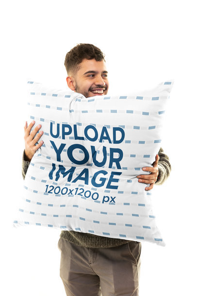 Mockup of a Happy Man Holding a Floor Pillow