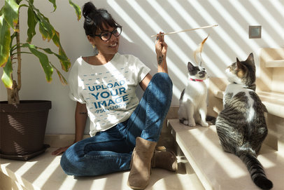 Woman Playing with her Cats Wearing a T-Shirt Mockup