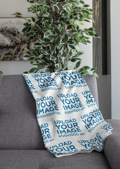 Mockup of a Throw Blanket Placed over a Couch