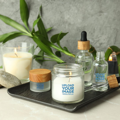 Mockup of an Aromatic Candle Placed Next to a Cosmetic Jar and a Dropper m30425 r-el2