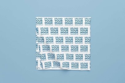 Mockup of a Sublimated Tablecloth Folded over a Color-Customizable Surface