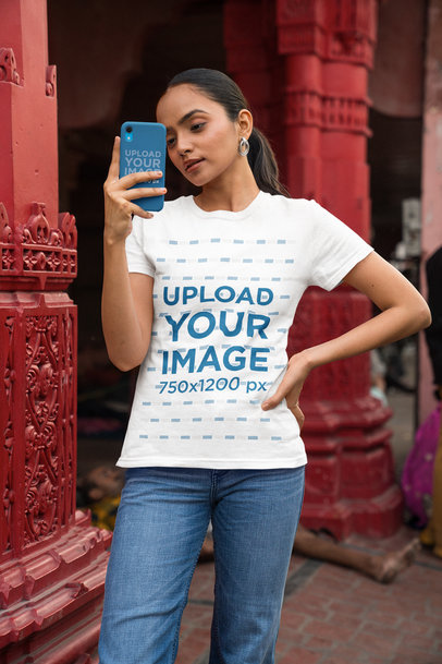 Phone Case and Tee Mockup Featuring a Woman Taking a Picture