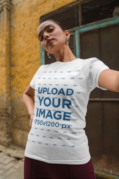 Round-Neck Gildan Tee Mockup of a Woman with Earrings Taking a Selfie
