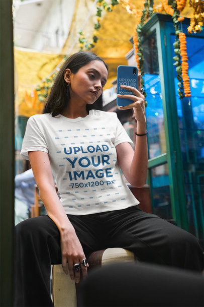 Phone Case Mockup of a Woman in a Round-Neck Gildan Tee Taking a Selfie