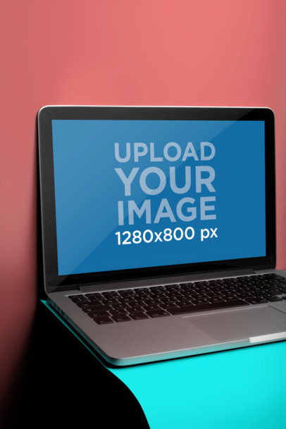 Front Shot Mockup of a MacBook Pro Resting on a Curved Surface a20455
