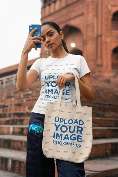 Tote Bag and Phone Case Mockup Featuring a Woman Wearing a Gildan T-Shirt
