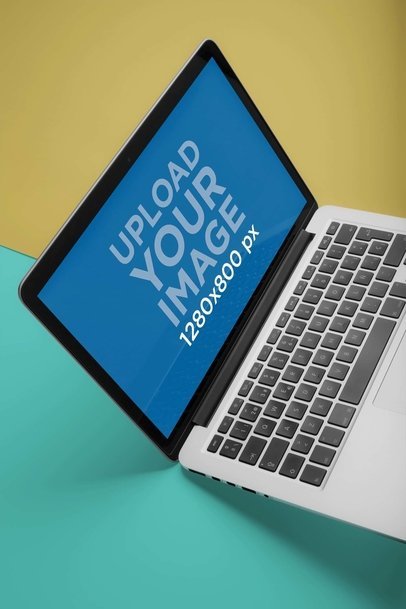 Angled Shot Mockup of a MacBook Pro on a Bicolored Surface