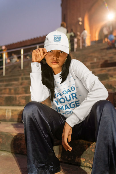 Sweatshirt Mockup Featuring a Woman Posing with a Dad Hat