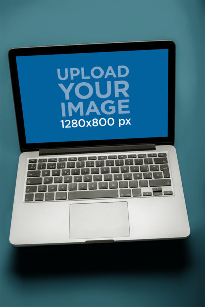 Overhead View Mockup of a MacBook Pro on a Solid Surface a20457
