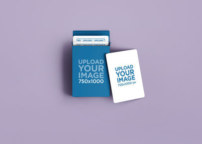 Mockup of a Playing Card Lying Next to a Playing Card Box