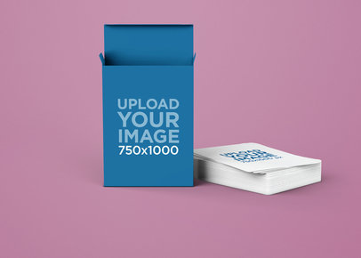 Mockup of a Playing Card Box Featuring a Pile of Cards