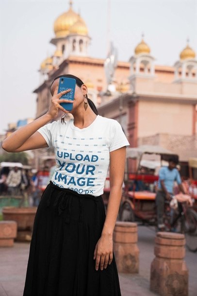 Phone Case Mockup of a Woman Wearing a Round-Neck Gildan T-Shirt