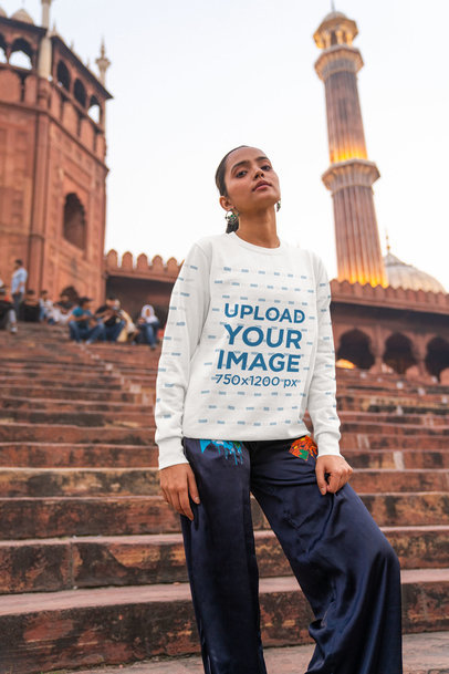 Sweatshirt Mockup of a Woman Posing Against a Historical Monument