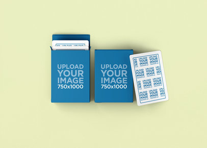 Mockup of Two Playing Card Boxes and a Playing Card Lying on a Colorful Background