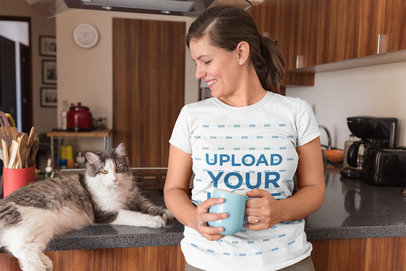 Cat Lady Wearing a T-Shirt Mockup Holding a Cup of Coffee