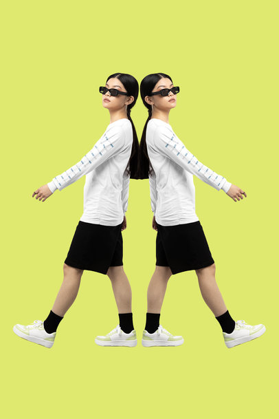 Mockup of a Mirrored Woman Wearing a T-Shirt with a Customizable Long Sleeve