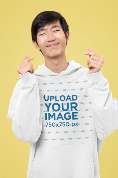 Hoodie Mockup of a Smiling Man Featuring a Kawaii Theme