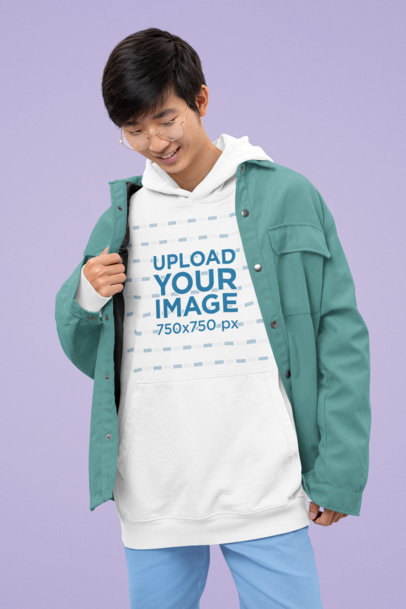 Oversized Pullover Hoodie Mockup of a Man with Glasses Posing in a Studio