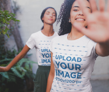 Interracial Women Wearing Shirts Mockup Blocking the Camera Near Plants