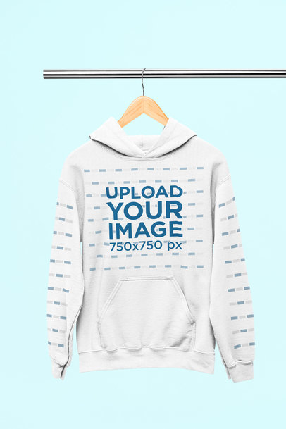 Mockup of a Gildan Pullover Hoodie Hanging from a Steel Bar
