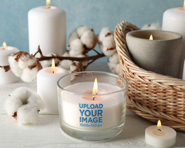 Mockup of a Candle Surrounded by Cotton Plants and a Basket m30385 r-el2