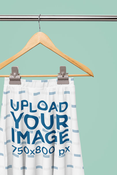 Mockup of a Skater Skirt Placed on a Wooden Hanger m31105