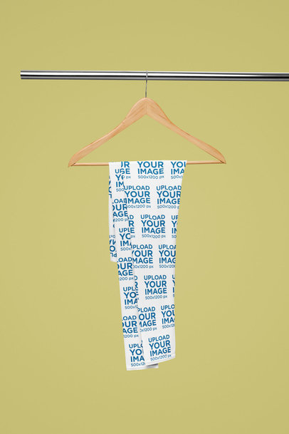 Mockup of a Pair of Sublimated Leggings Placed on a Hanger