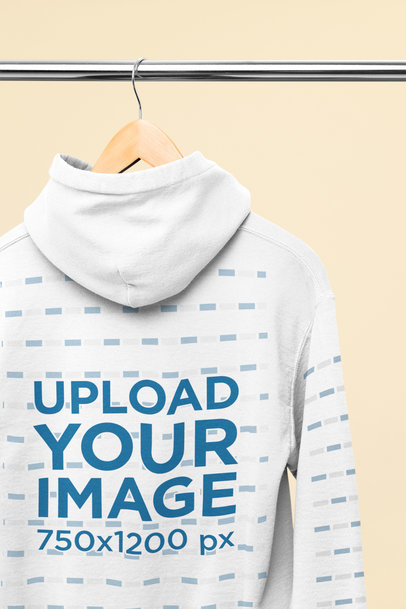 Back-View Mockup of a Hoodie Placed on a Wooden Hanger