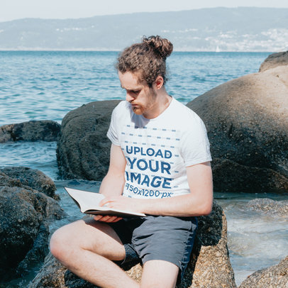 T-Shirt Mockup of a Man Reading a Bible by the Beach m30605 r-el2