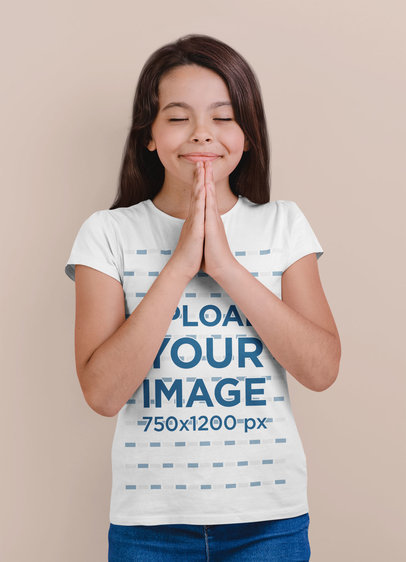 T-Shirt Mockup Featuring a Smiling Girl Praying