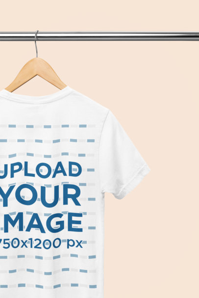 Back-View Bella Canvas T-Shirt Mockup Hanging from a Steel Bar