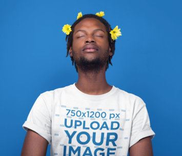 Man Meditating Wearing a T-Shirt Mockup and Flowers on his Head