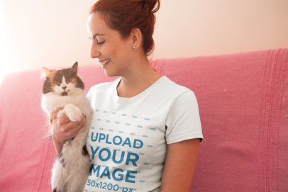 Happy Woman Wearing a T-Shirt Mockup Smiling at her Cat