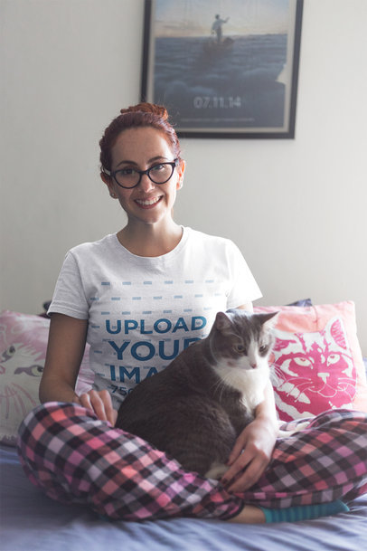 Woman with Glasses Wearing a Tshirt Mockup in Bed with her Cat