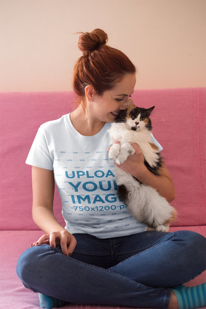 Red-Head Woman Wearing a T-Shirt Mockup while Holding her Cat