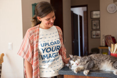 T-Shirt Mockup of a Woman Caressing her Cat at Home